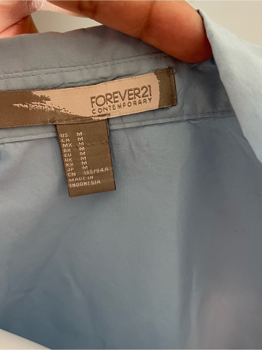 This is a light blue Forever 21 sleeveless top size medium
Like new condition - Picture 11 of 11